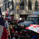 People gather for a 'freedom convoy' rally in Canada, with both American flags and Canadian flags displayed